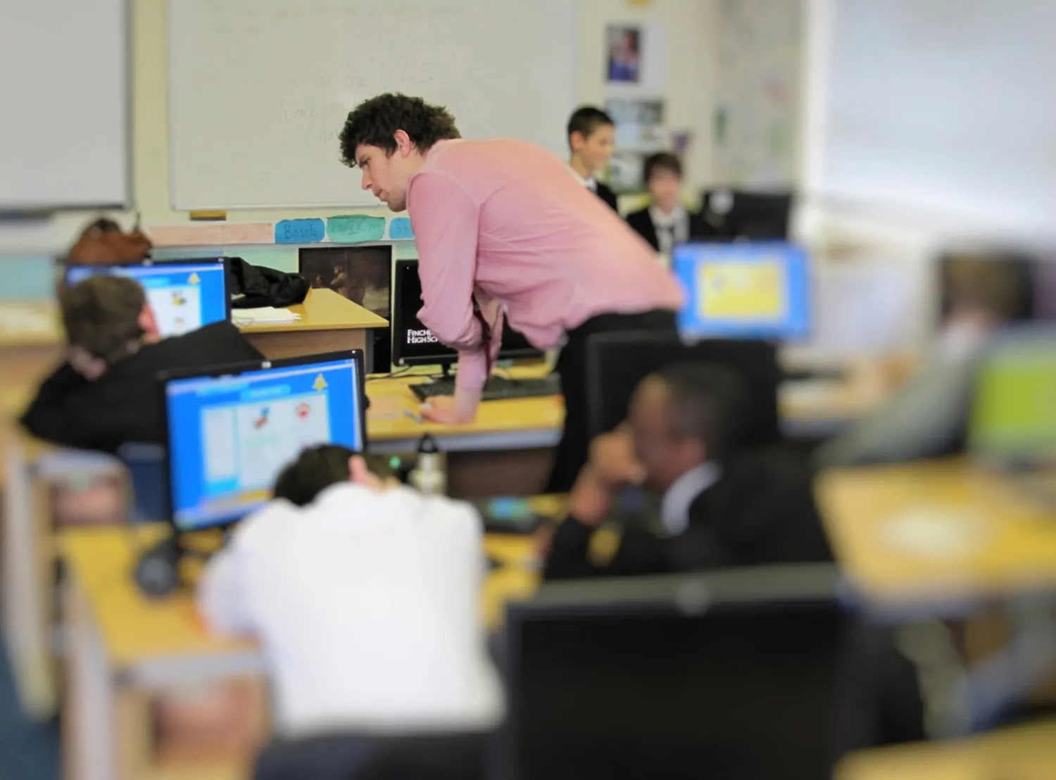 Classroom research session — a teacher working with students at computers